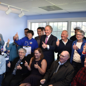 senator ed Markey with a group of falmouth democrats giving the thumbs up